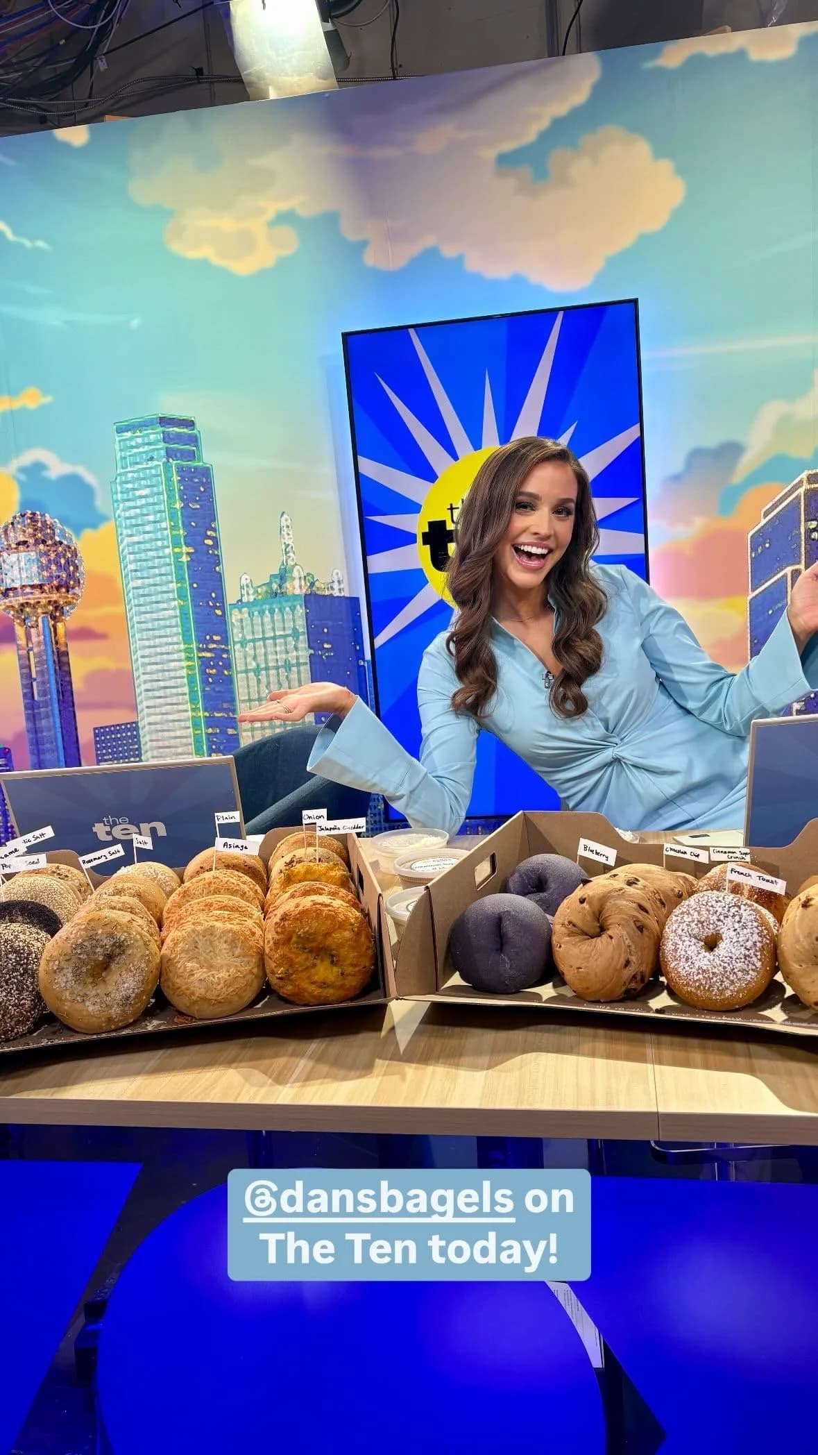 Dan's Bagels featured on Dallas TV show The Ten with reporter and Reunion Tower backdrop